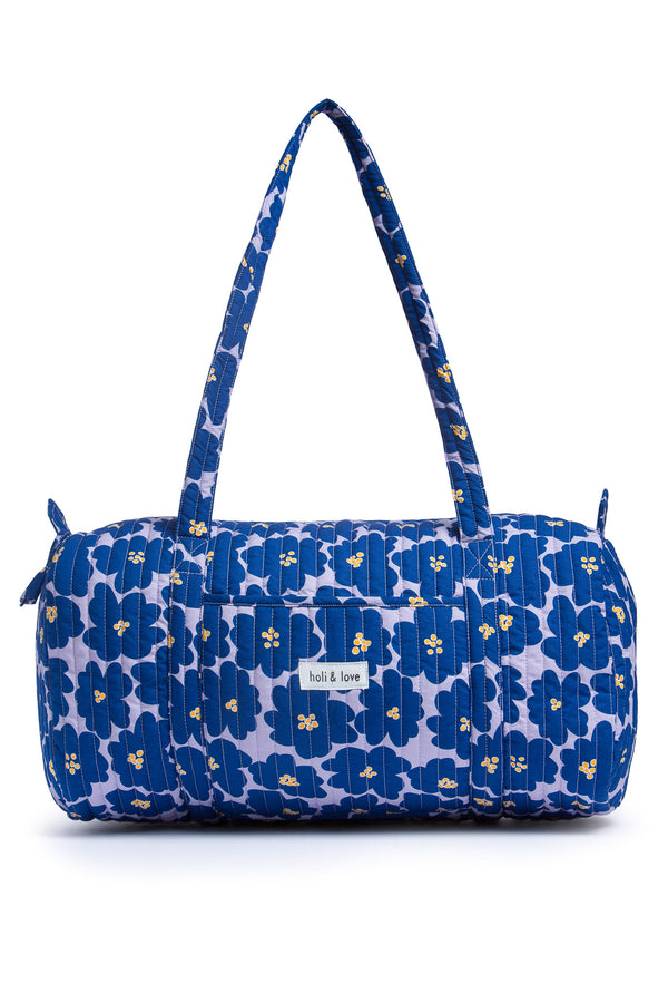 Sac weekeend polochon, pour le voyage ou le travail, imprimé big flower, grandes fleurs navy sur fond lilas. Accesoire de voyage et de mode pour femme en coton.